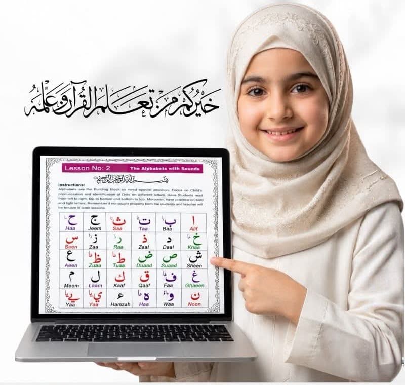 Girl pointing to the Arabic alphabet chart on a laptop